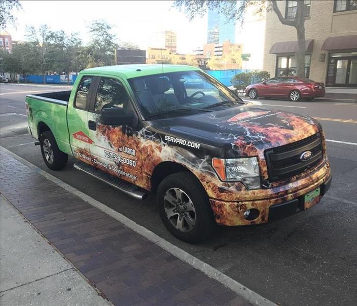 SERVPRO pickup truck with company wraps parked on street