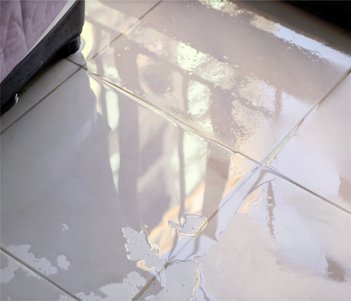 puddles of water on tile floor